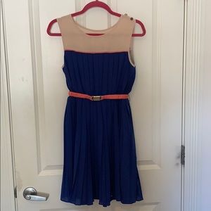 Royal blue pleated dress with coral pink belt